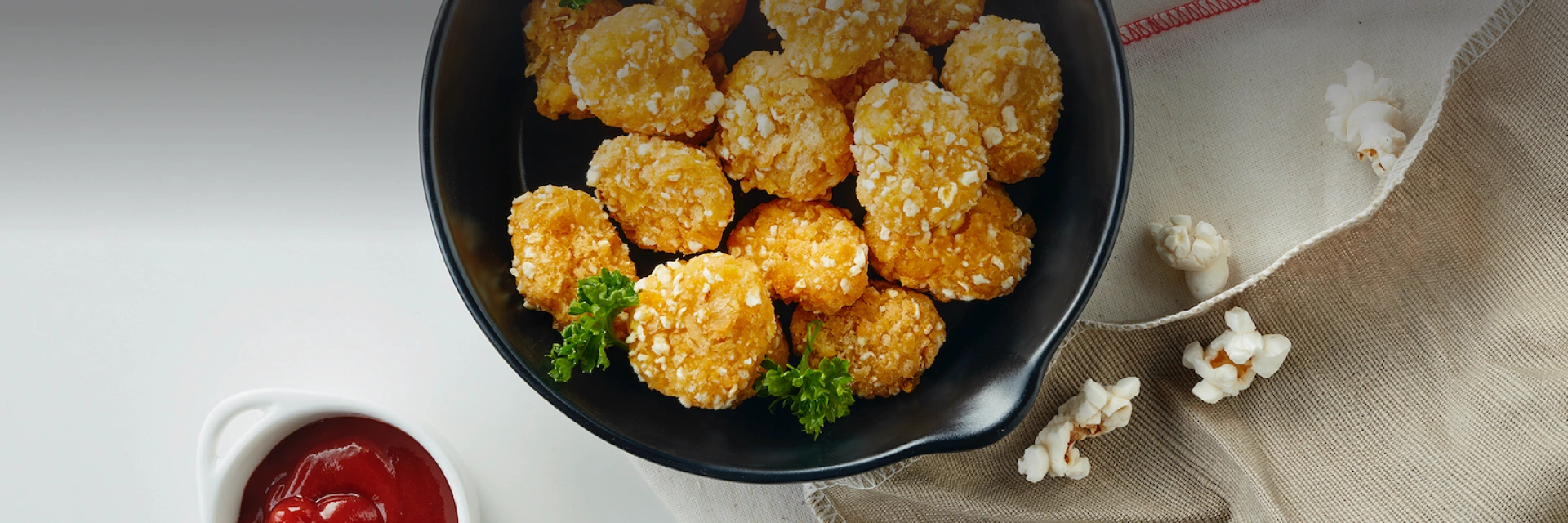 Popcorn Chicken made from plants, infused with real popcorn flakes. Easy to enjoy and healthier!